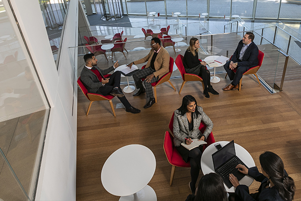 Overhead photo of EMBA/MS students sitting in a lounge